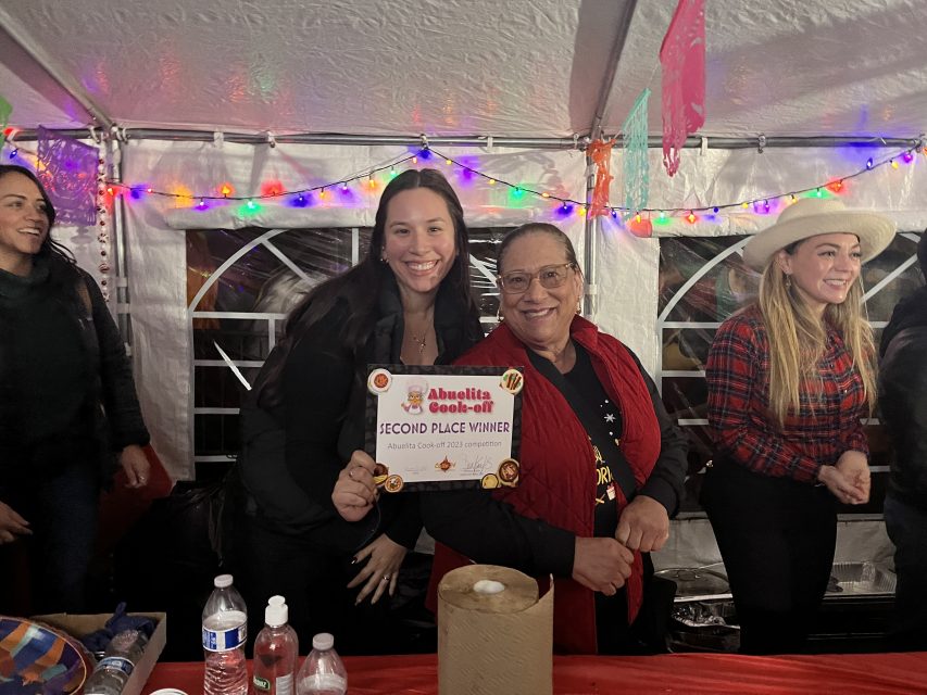 Elena Vargas and her mom Irma Vargas holding their second place certificate at abuelita cookoff.