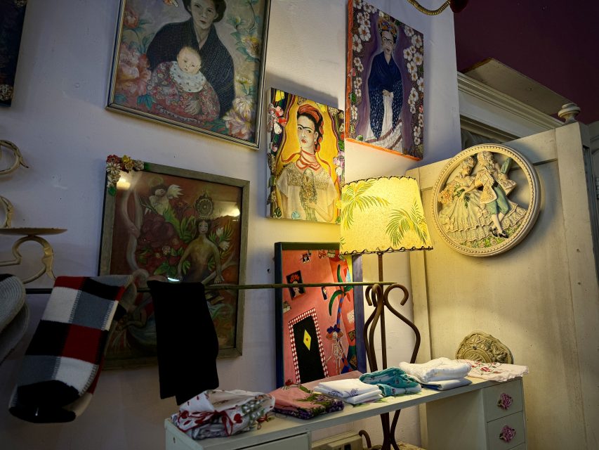 A room with a lot of art on the walls.