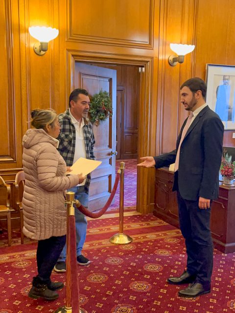 Two vendors handing over their letter of demands to Mayor's staff in Mayor's office at San Francisco city hall. 