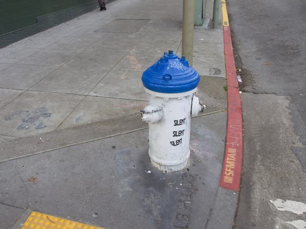 A fire hydrant on the side of a street.