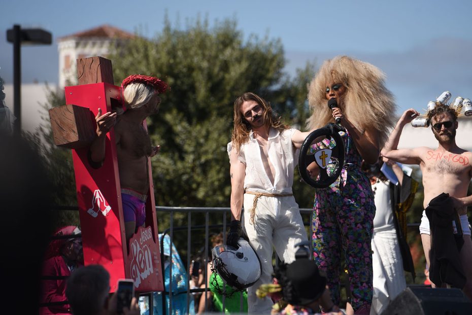 Group of individuals with eclectic attire participating in an outdoor event.