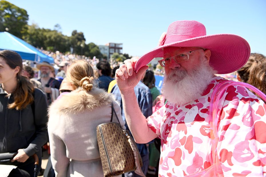 Man in pink outfit and hat at Hunky Jesus.