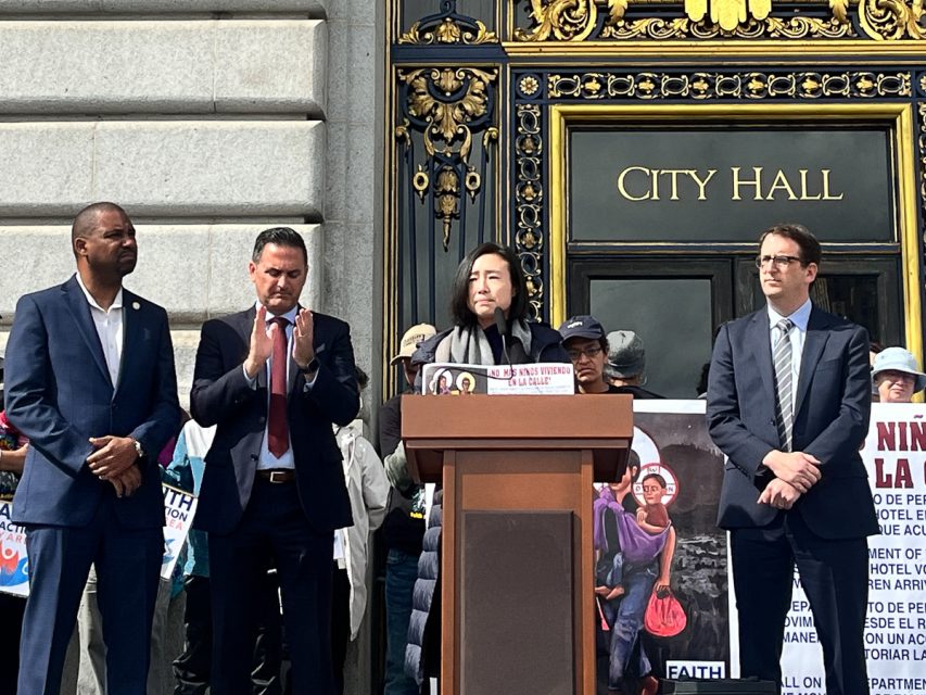Supervisor Connie Chan speaking at a rally, to her left are supervisors  Shamann Walton and Ahsha Safaí. And to her right is Supervisor Dean Preston.